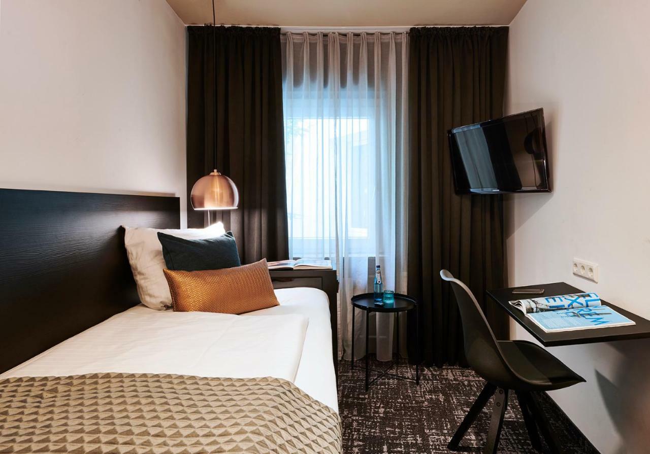 Dom Hotel ออสนาบรึค ห้อง รูปภาพ